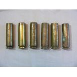 Six 30mm brass Shell Casings.