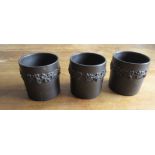 Three small black Wedgwood Pots