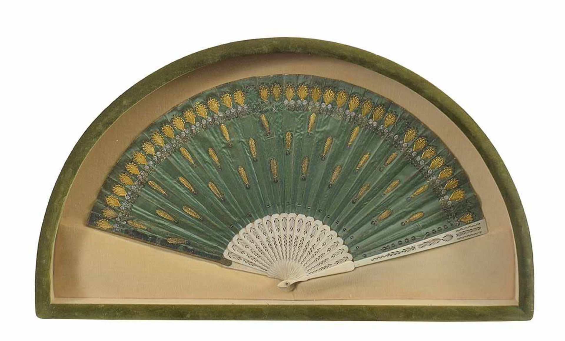 An ivory and green silk fan 19th century, 29by54cm.