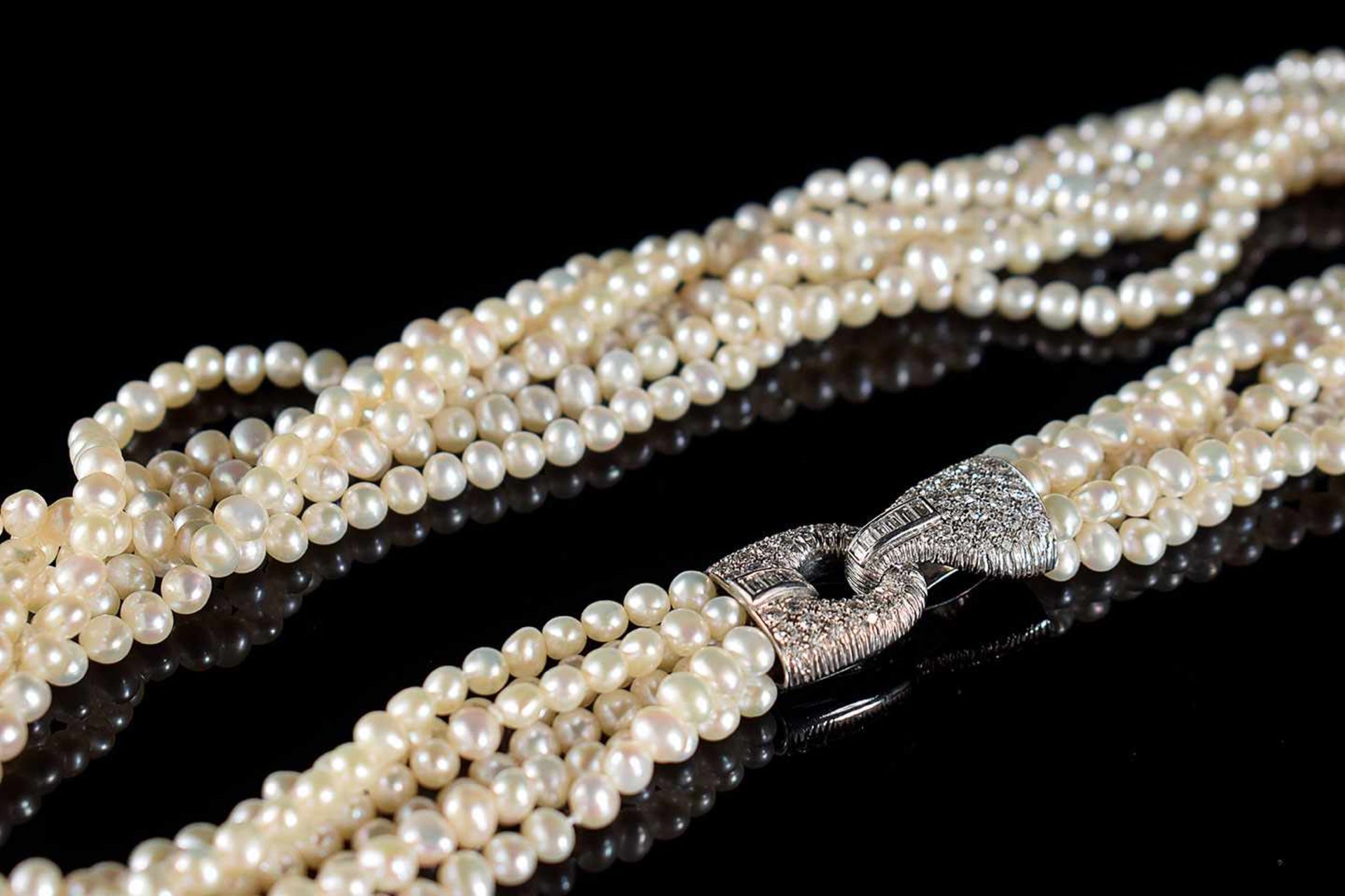 A pearls, gold and diamonds collier the diamonds round and baguette cut, 2,60ct. total, 44cm.long