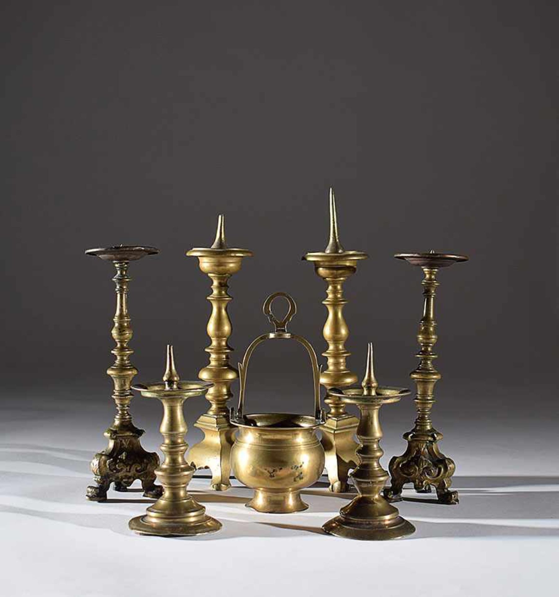 Three pair of bronze twists and a small bucket, from 17th to 19th century, from 9cm. to 33cm. high