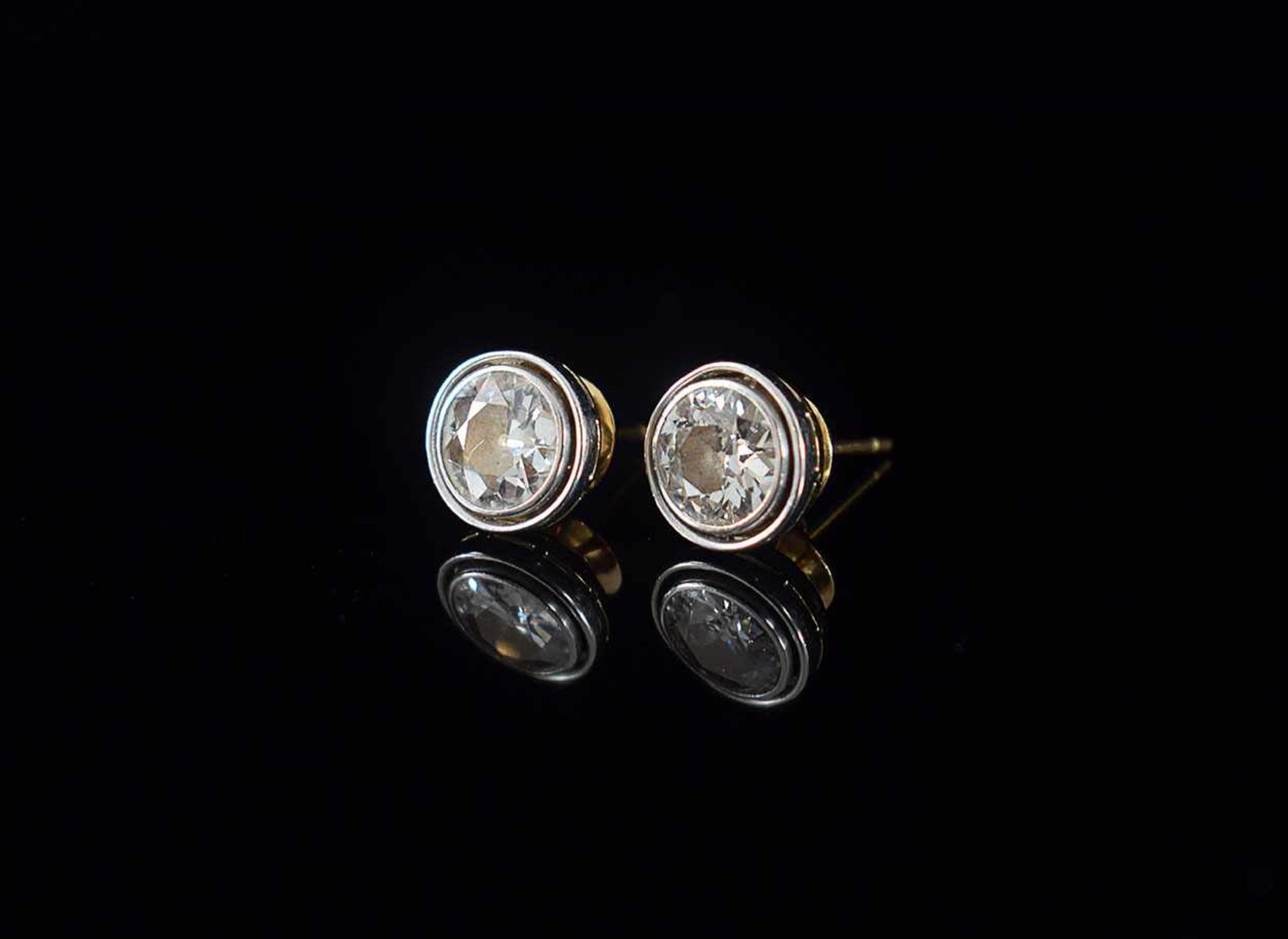 A pair of gold and diamonds earrings the diamonds 3,40ct. total, probably color I, purity SI1