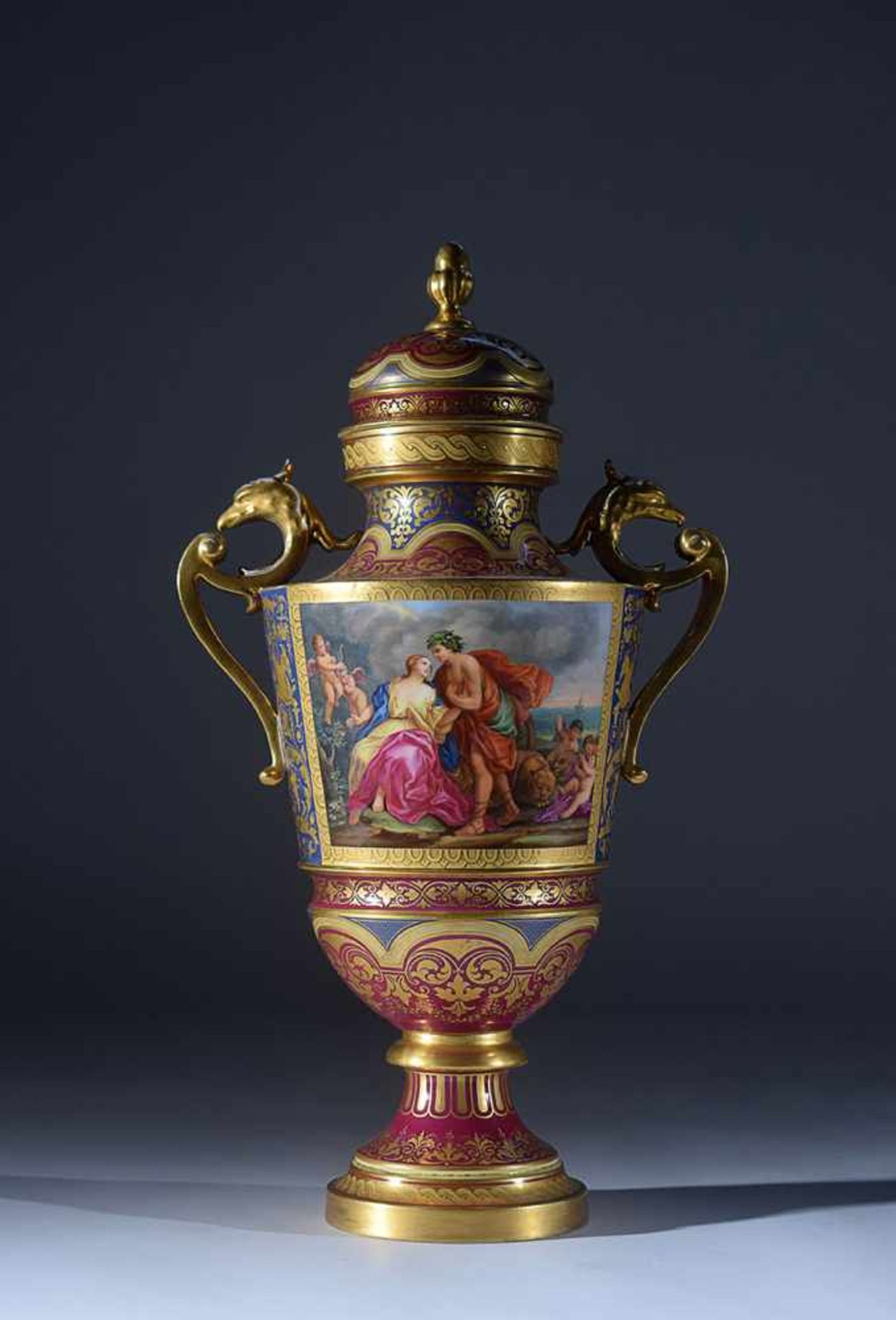 A Vienna gilt and polychrome porcelain urn 19th century, 53cm. high