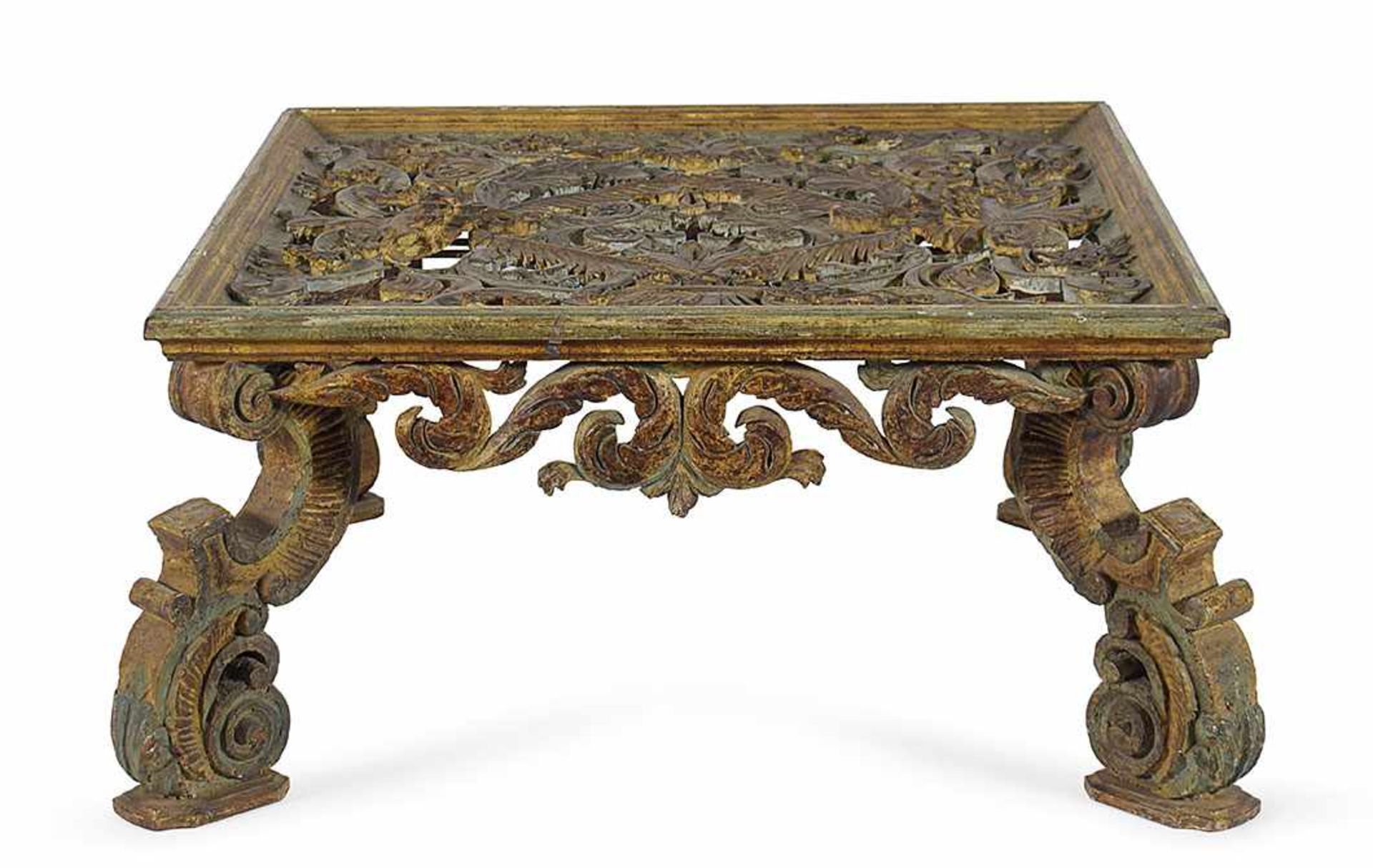 A gilt and lacquered carved coffee table 52x104x104cm.