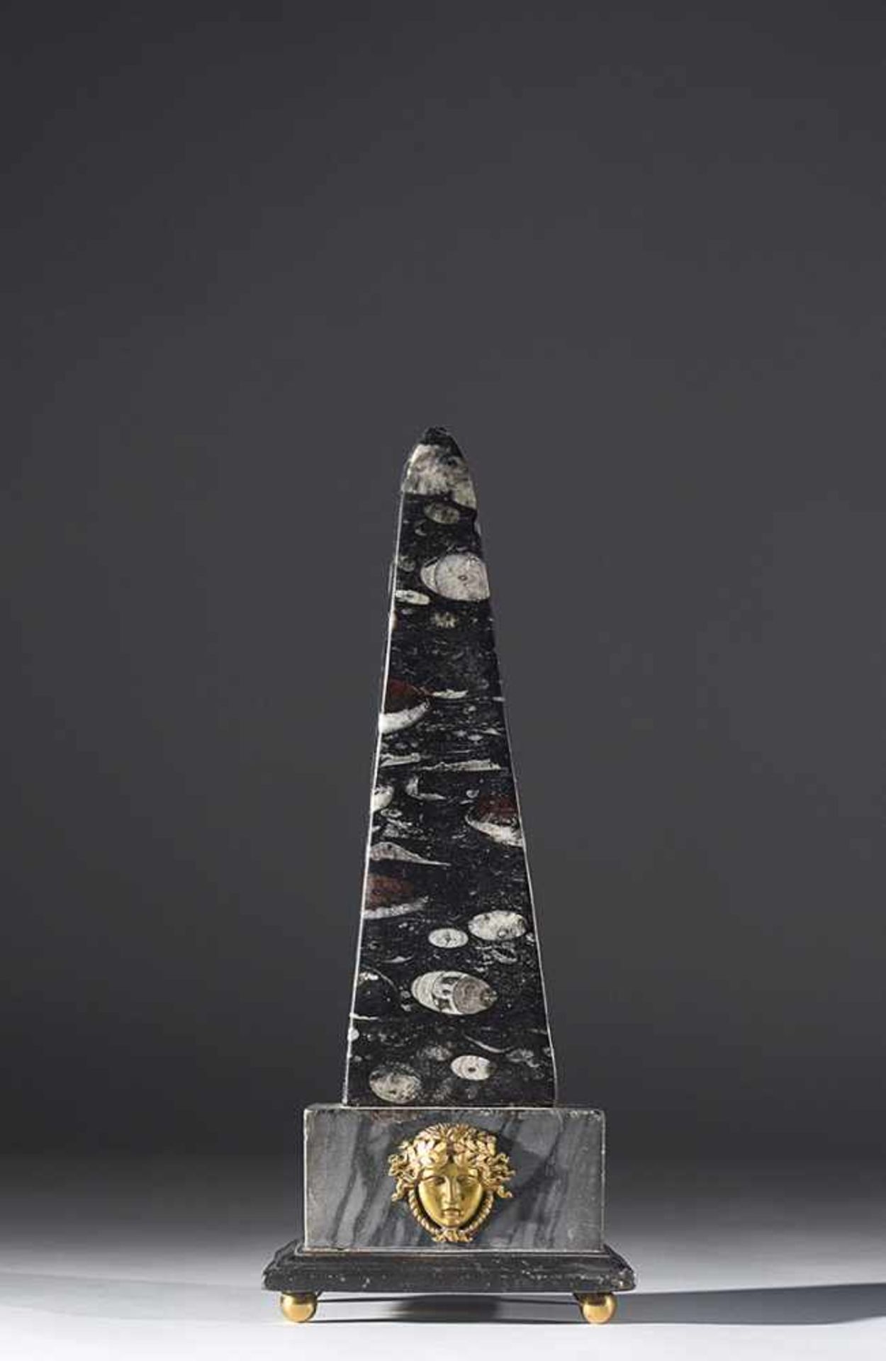 A Roman lumachella obelisk on a rectangular base in grey marble, early 19th century, 36cm. high