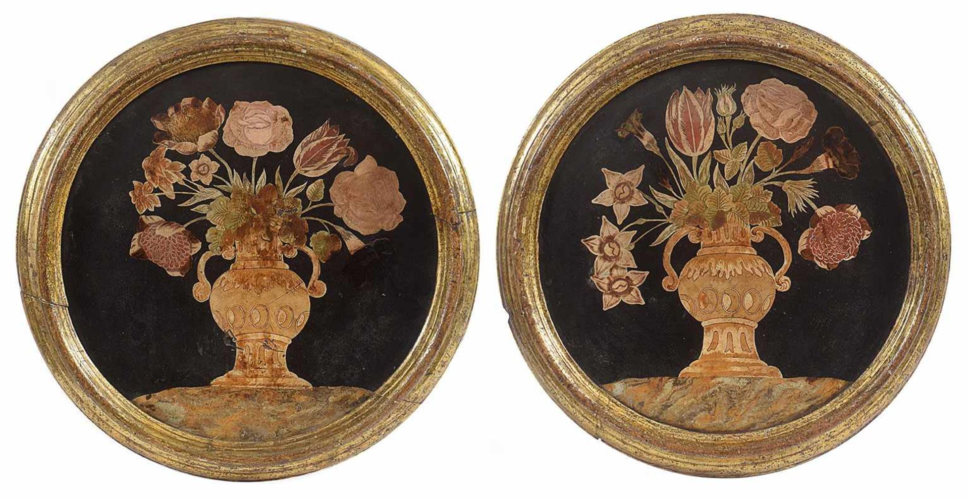 A pair of tuscan scagliola circular medallions each representing a flower vase, 18th century,