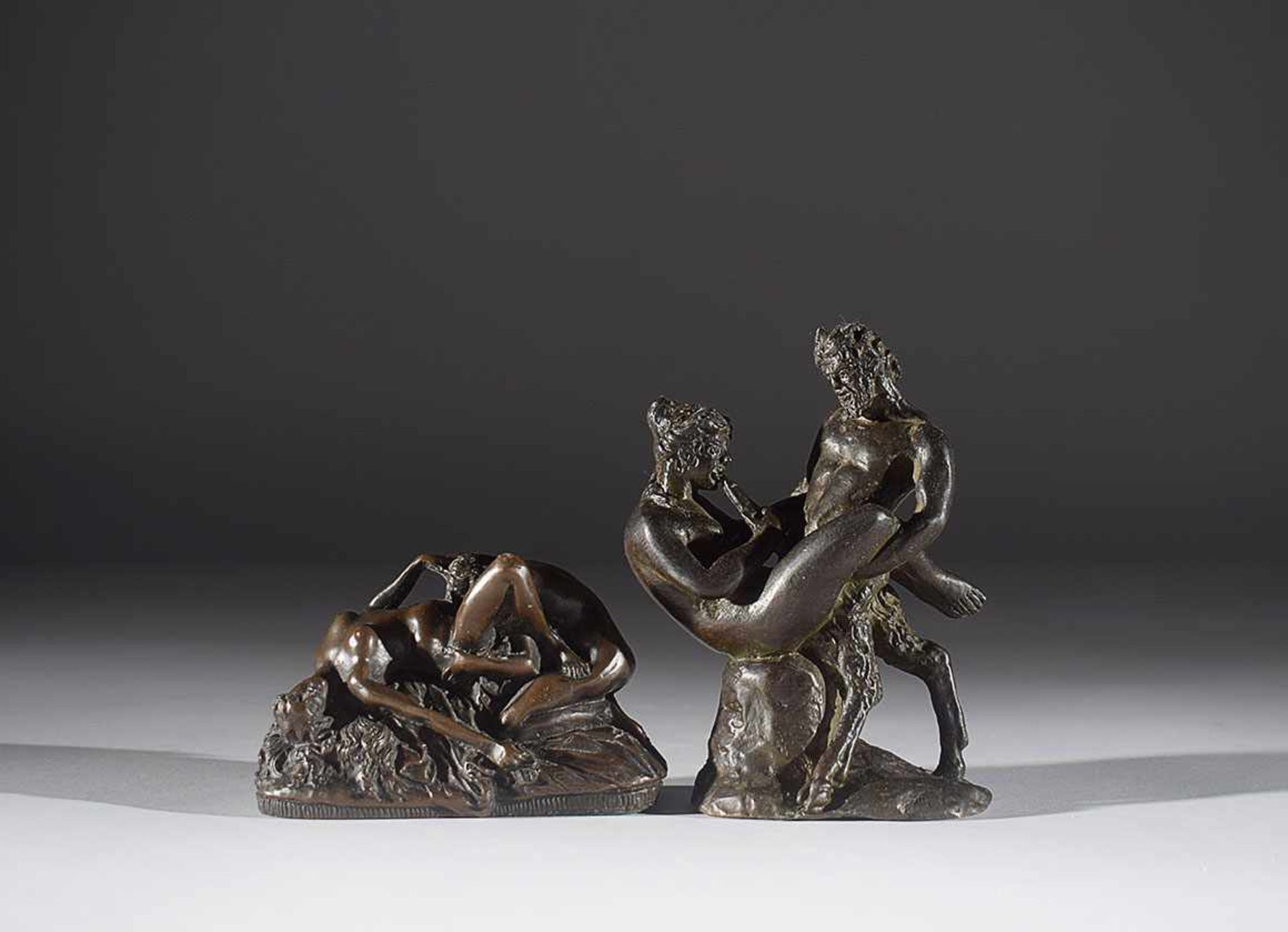 Two patinated bronze small erotic groups early 20th century, 14x9cm.; 7x11,5cm.