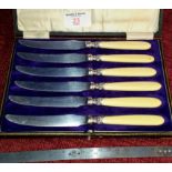 Set of six silver collared butter knives in fitted case