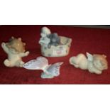 4 Nao figures of dogs, butterfly & 2 cherubs