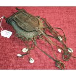 Benin brass/bronze purse with hanging shell trinkets, 35cm long