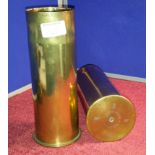 A pair of 1917 brass shells, 23cm tall