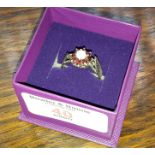 Silver ladies ring with garnet and opal