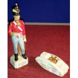 British officer figure, together with Arcadian China modal of a tank with City of Nottingham crest