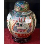 Chinese Famille Rose temple jar on hardwood stand, 30cm tall