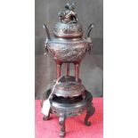 Bronze censor pot with Foo Dog lid on hardwood stand, 40cm tall