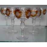 A set of 6 Bohemian crystal cut wine glasses with amber coloured panels