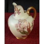 Royal Worcester flower design gilt handled jug, 13cm tall