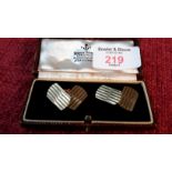 A pair of 9ct gold cuff links