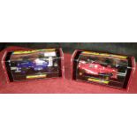 2 boxed scalextrics car models