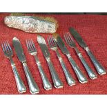 Silver handled fork & knife set, together with ornate silver couple scene brush