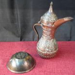 Copper Arabic water jug filled with lead shot, together with 2 small Arabic dishes, 26cm tall