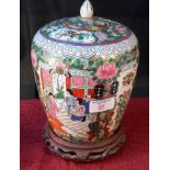 Chinese Famille Rose temple jar on hardwood stand, 25cm tall