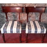 A pair of re-upholstered chairs