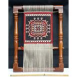 Hand woven tapestry on hardwood stand