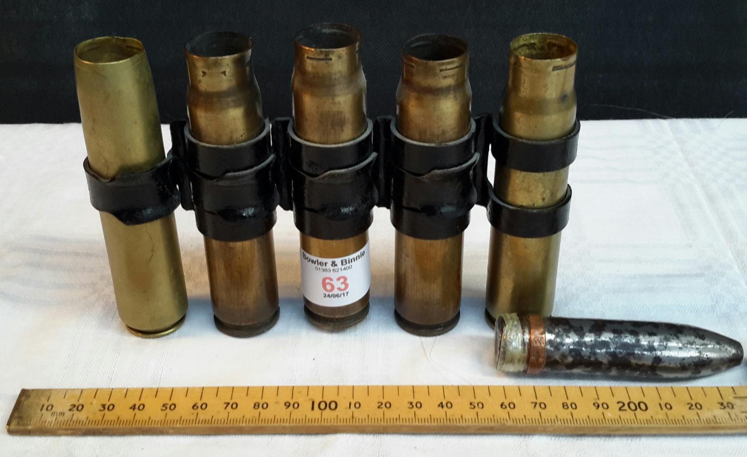 A clip with 5 WW2 20mm canon shell cases