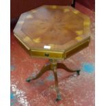 Octagonal top side table on single pedestal support on claw castor feet