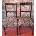 A pair of tapestry based chairs