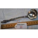 A Victorian London silver ornate gravy ladle with boar head design. 15cm long