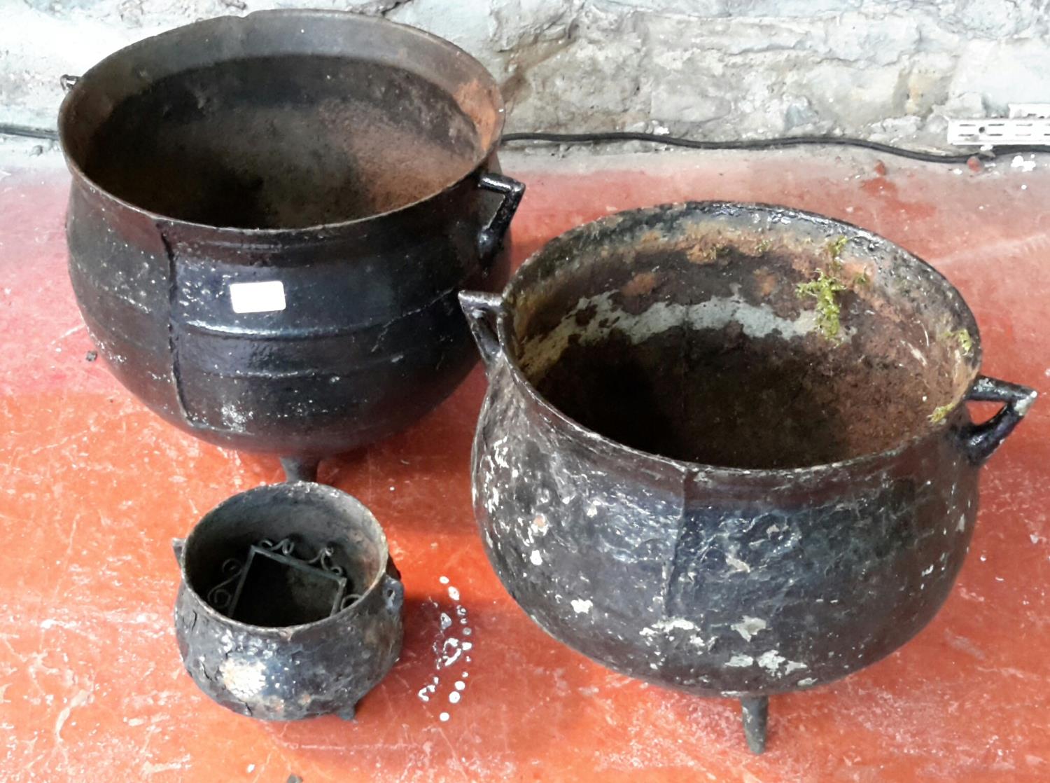 2 large cast metal cauldron planters & 1 other