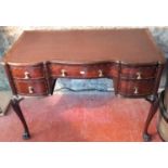 A Victorian brown leather top desk with claw feet
