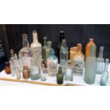 Selection of old glass bottles & stoneware bottles