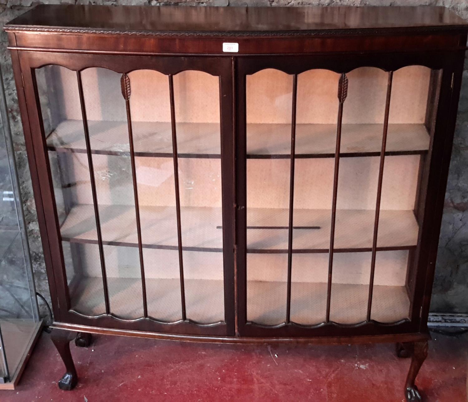 Mahogany china cabinet with ball & claw feet.