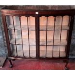 Mahogany china cabinet with ball & claw feet.