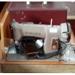 Electric singer sewing machine in its fitted case