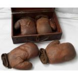 Case containing 2 pairs of vintage boxing gloves