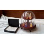 A set of Ladies of Fashion miniature figures in dome display case