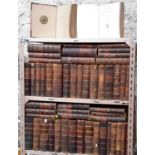 Approximately 100 French reference books in hard leather bounds with gold crests in each book, books