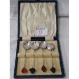 4 boxed Birmingham silver tea spoons with playing card emblems to the top