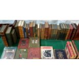 A collection of old hard back books to include Charles Dickens first edition, various poetic works &