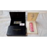 Givenchy designer lighter & box, together with Yves St Laurent lighter & box, both new