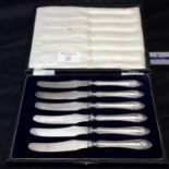 A set of silver handled Walker & Hall knives in fitted box