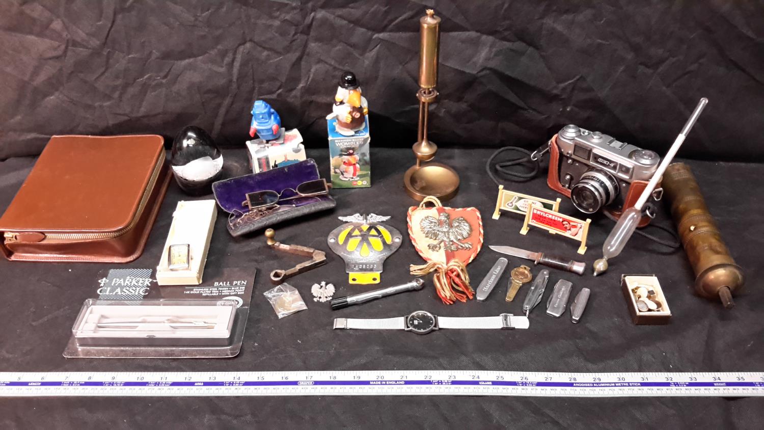 A selection of collectables to include ships paraffin lamp, AA badge, parker pen & vintage wind-up