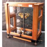 Oertling model 101 scales in fitted glass & wood case with weights