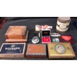 A collection of advertising tins, lighters & cigarette holder etc