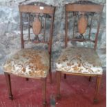 A pair of Edwardian inlaid chairs