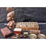 A selection of wooden collectables to include inlaid chess board, inlaid card box, large African